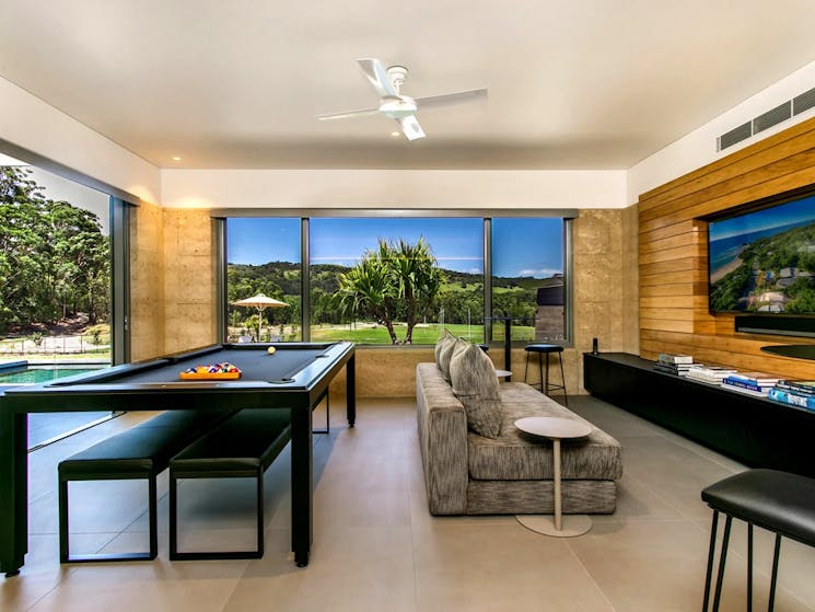 Living spaces and entertainment area featuring a billiard table for leisure and social gatherings