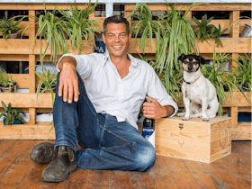 Dru Reschke, Koonara's owner and vigneron,  with Buster in the Koonara Cellar Door.