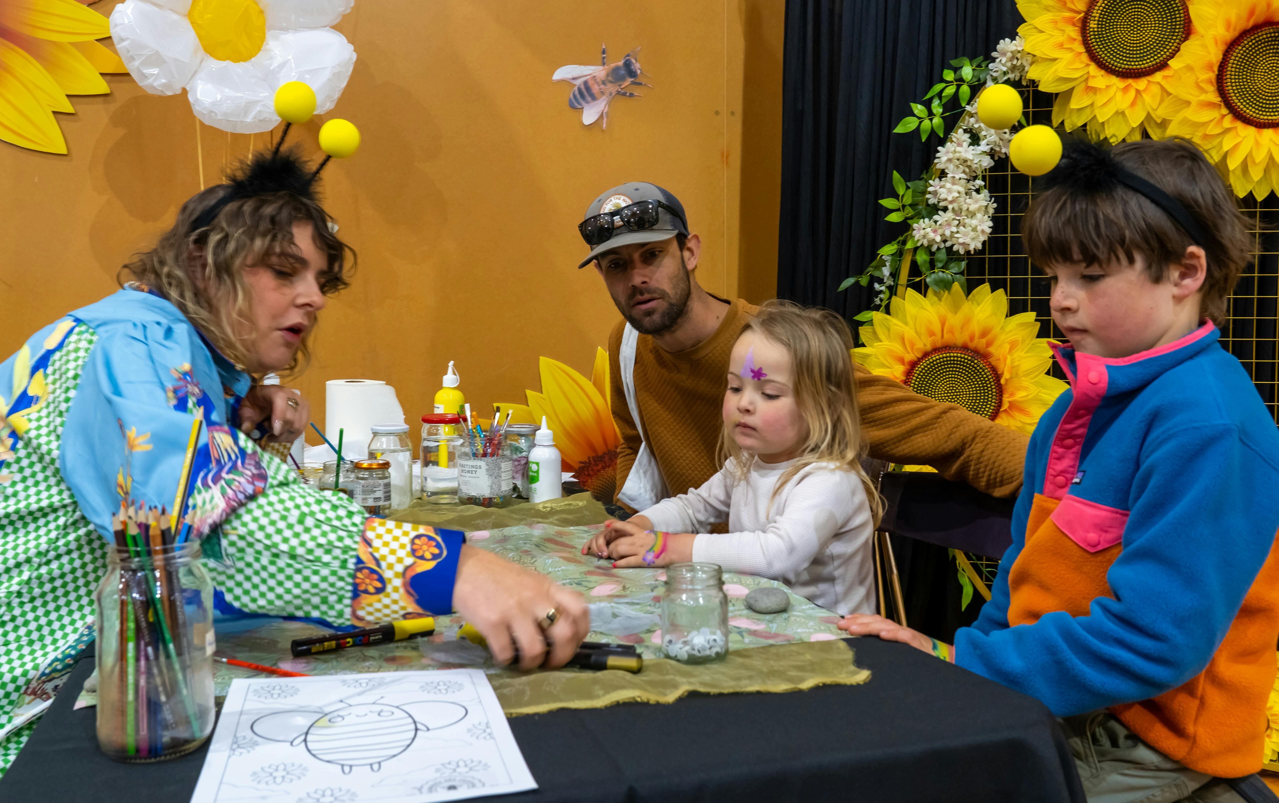 Ashton spent time with the children painting rocks, making bees and singing songs that delighted all