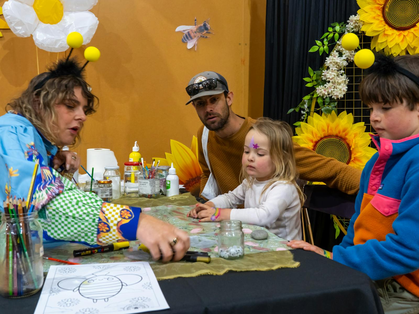 Ashton spent time with the children painting rocks, making bees and singing songs that delighted all