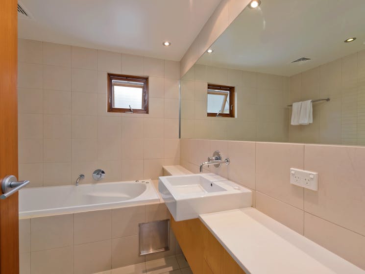 Snow Stream Apartments bathroom with separate shower and bathroom