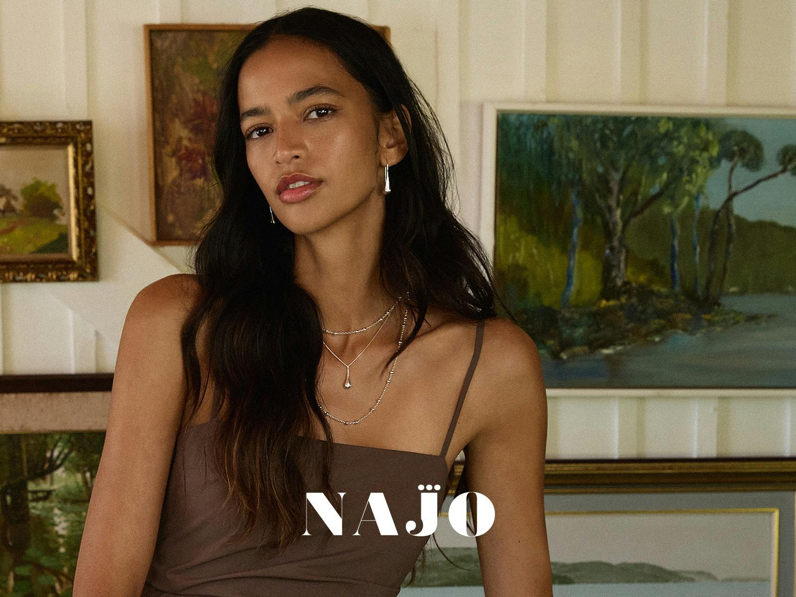 girl in brown dress with silver jewellery