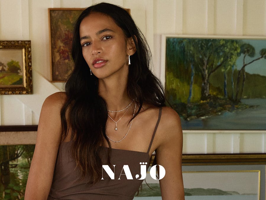 girl in brown dress with silver jewellery