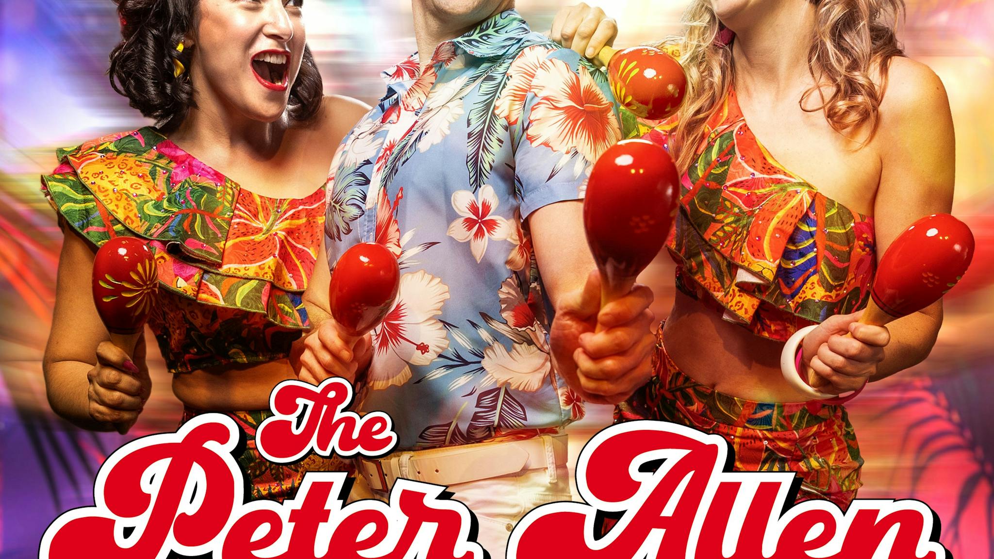 Three performers in tropical outfits stand with maracas, smiling at each other Three performers in tropical outfits stand with maracas, smiling at each other