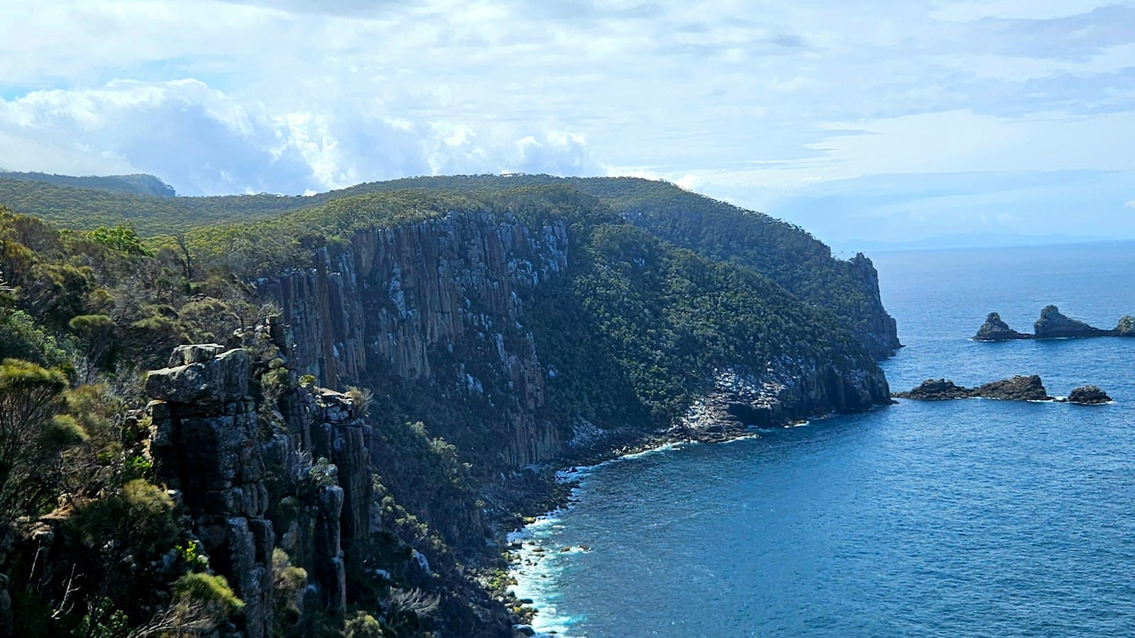 Endless ocean views and rugged cliffs define the Three Capes Walk Tasmania experience