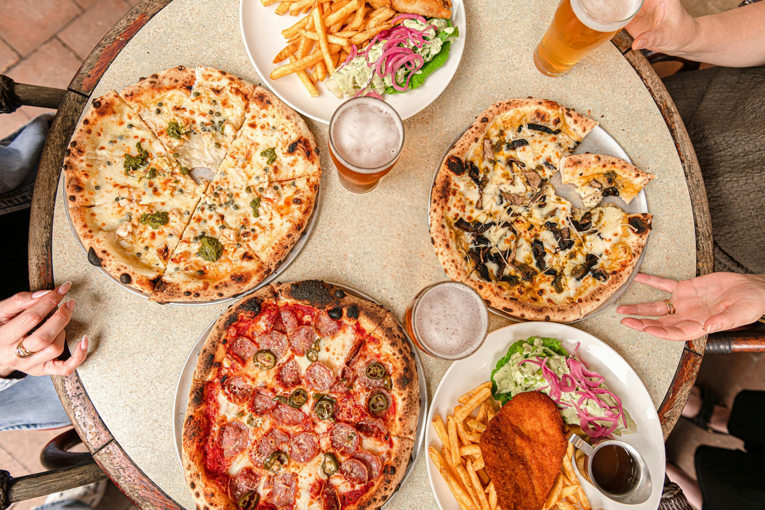 An array of pizzas and dishes at Hotel Brunswick - Hotel Brunswick