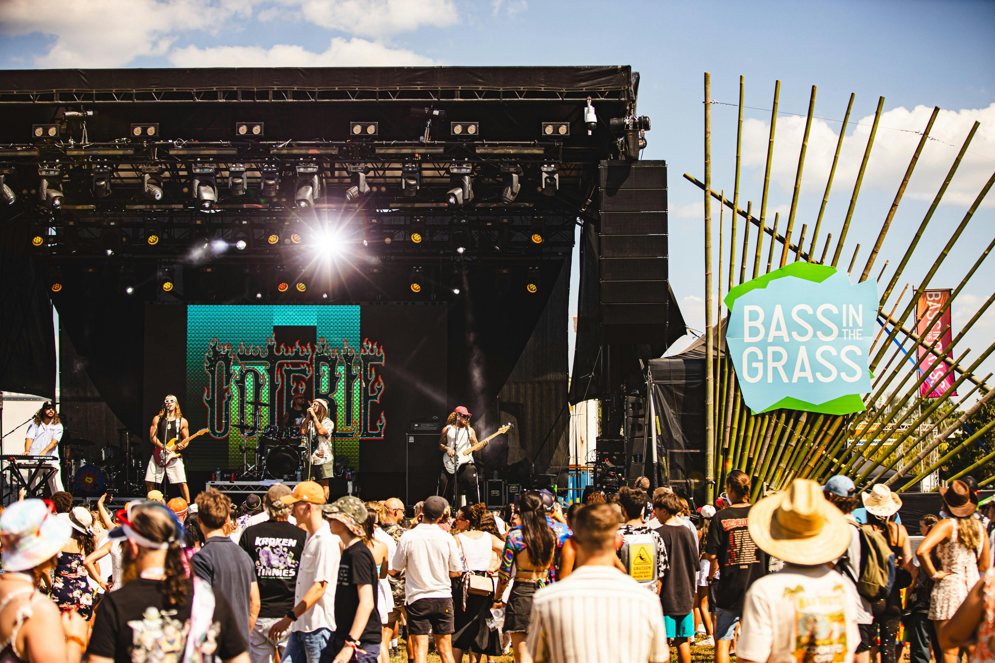 Coterie performing on stage in front of a crowd at BASSINTHEGRASS 2024