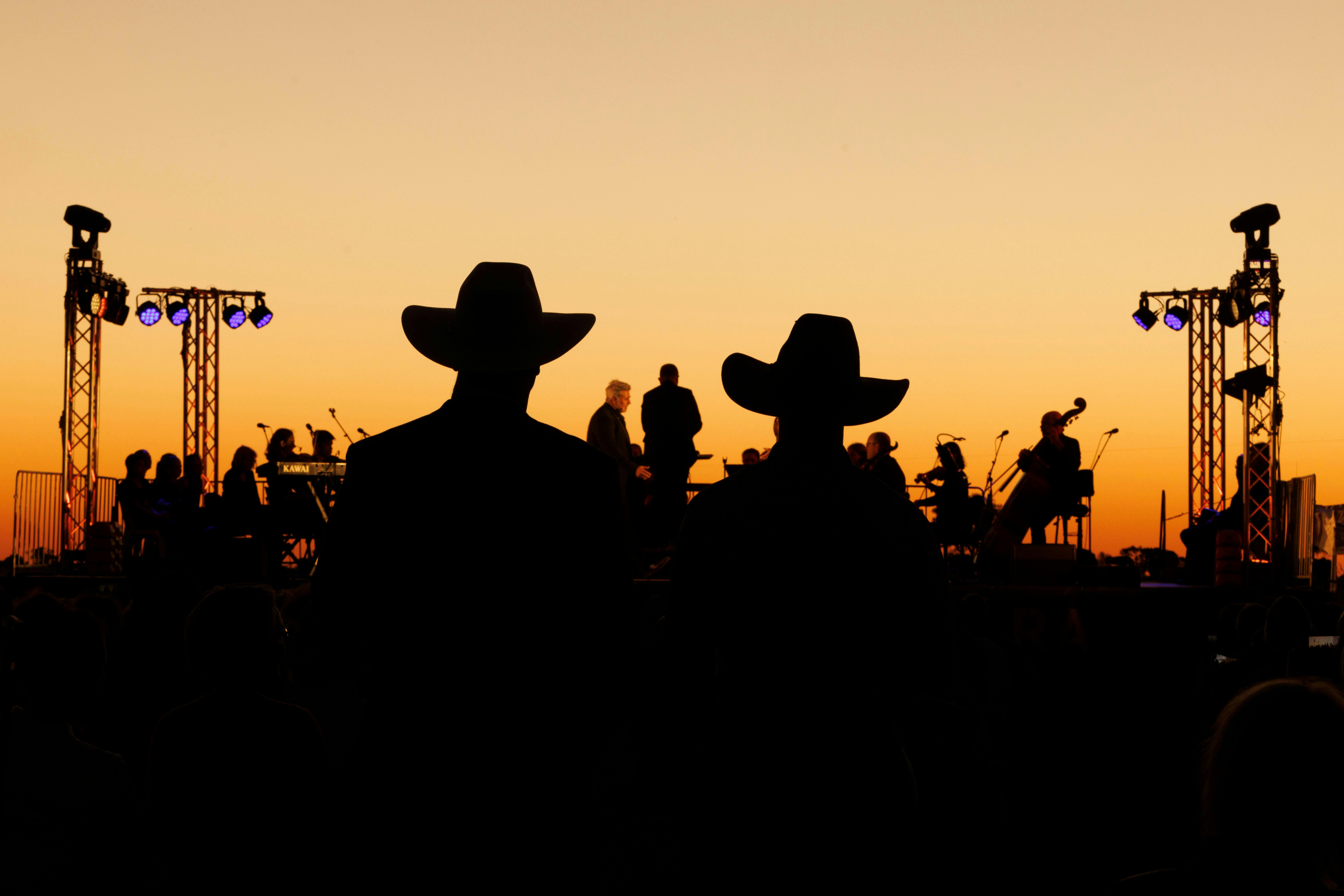 Silhouette of two cowboys at sunset at Camden Park Station