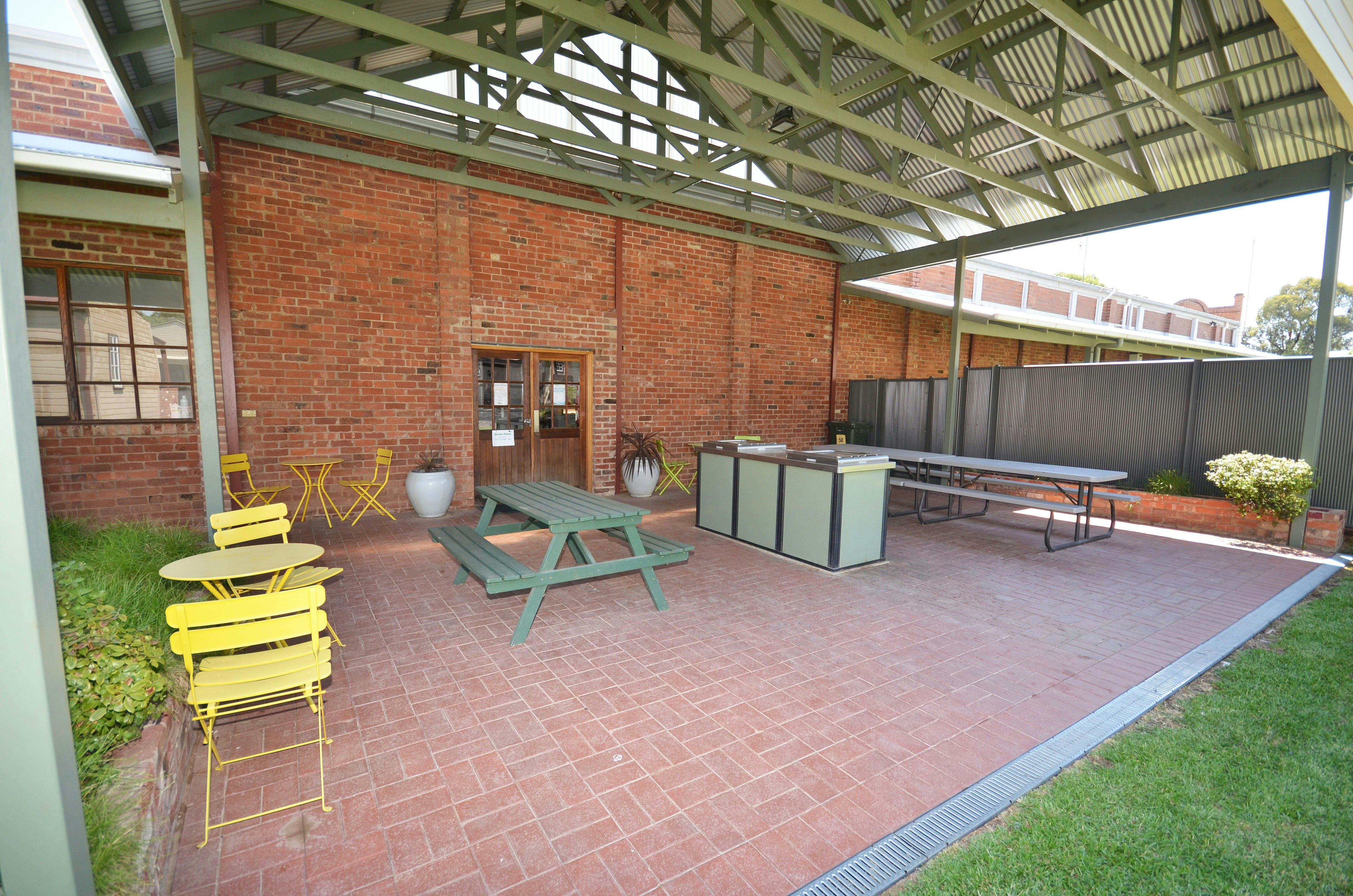 Undercover bbq area with tables and chairs