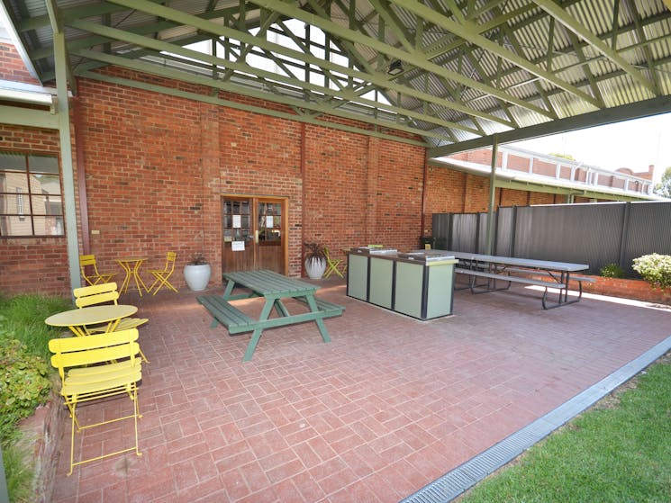 Undercover bbq area with tables and chairs