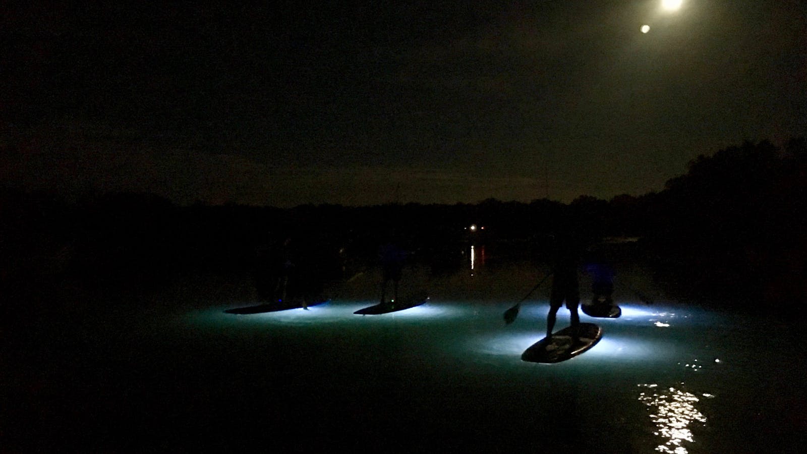 Sunset paddle , when the sun goes down and the lights come on under the boards..