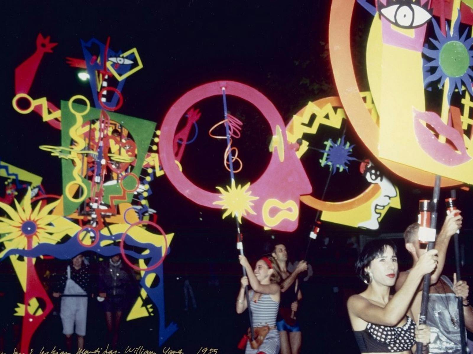 A photograph of people at a parade float.
