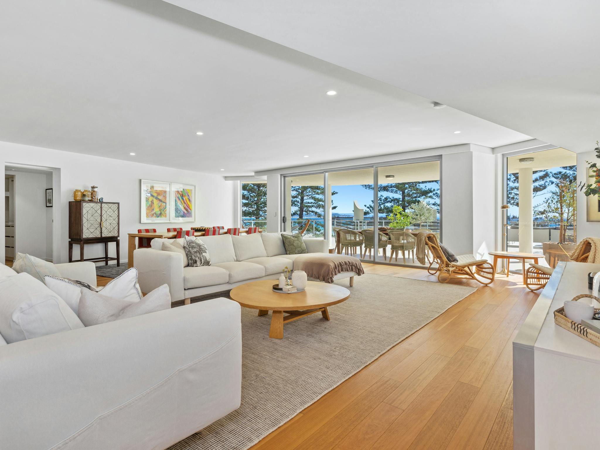 Spacious lounge featuring timber floors, neutral sofas, chaise lounge, and ocean views. Spacious lounge featuring timber floors, neutral sofas, chaise lounge, and ocean views.