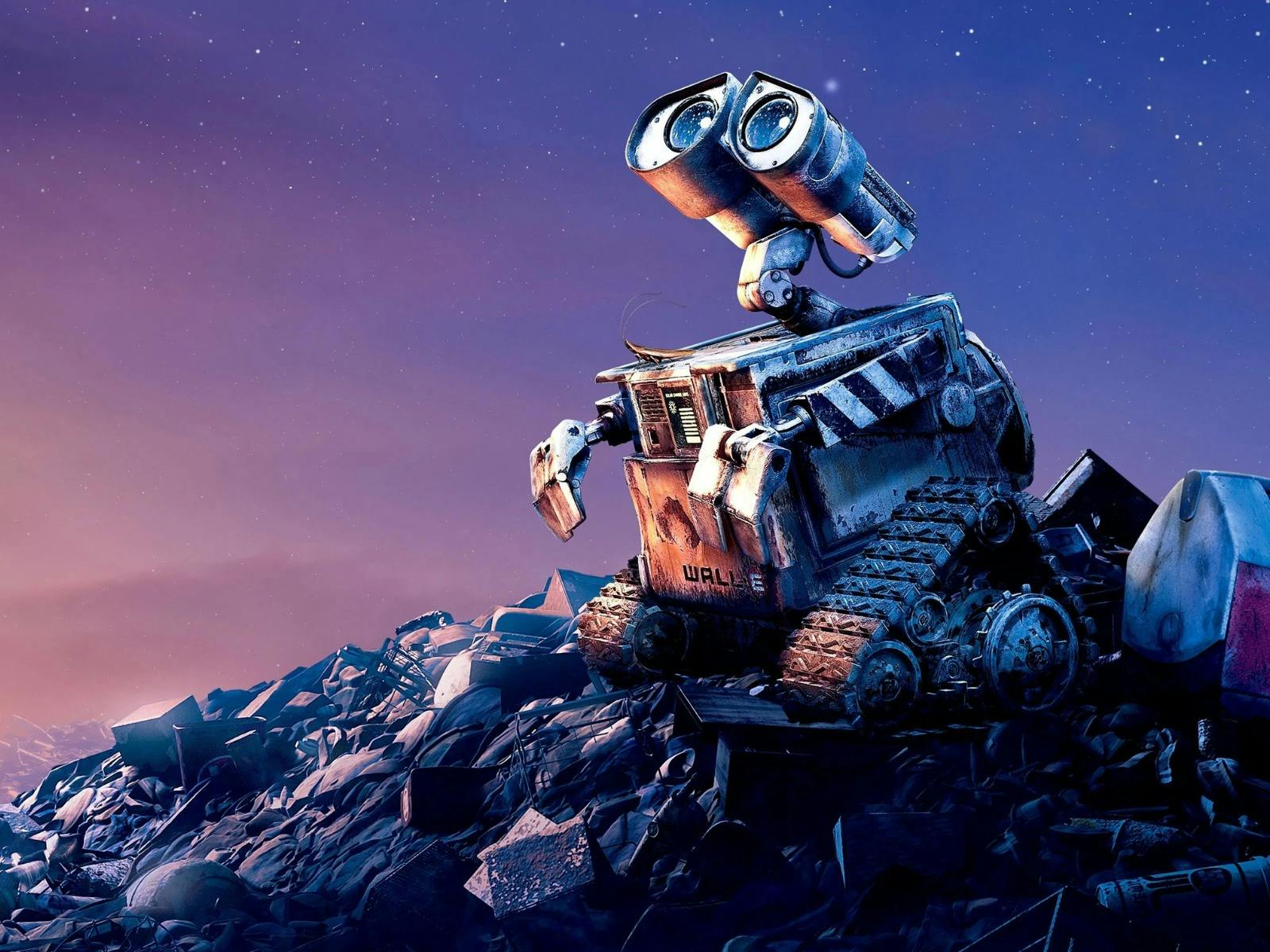 A small animated robot looks longingly up at the sky, sitting on a pile of rubbish
