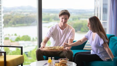 Enjoy in room dining overlooking Lake Ginninderra