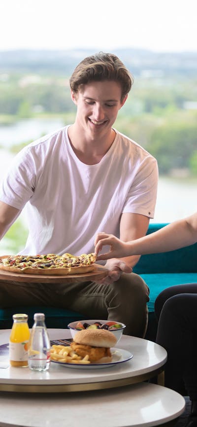 Enjoy in room dining overlooking Lake Ginninderra