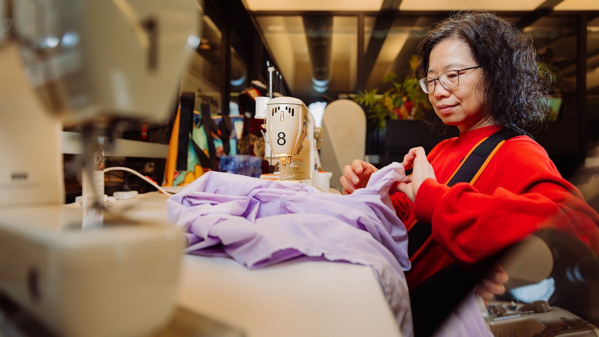 Woman using sewing machine