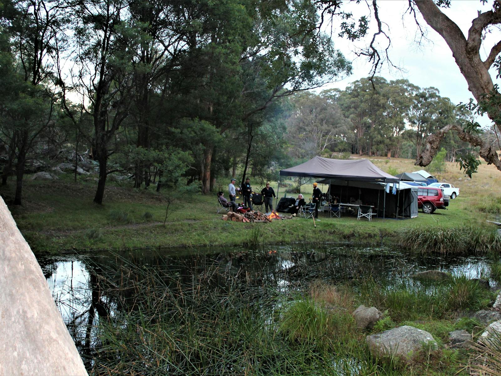 A campertrailer beside the water at one of our sites.