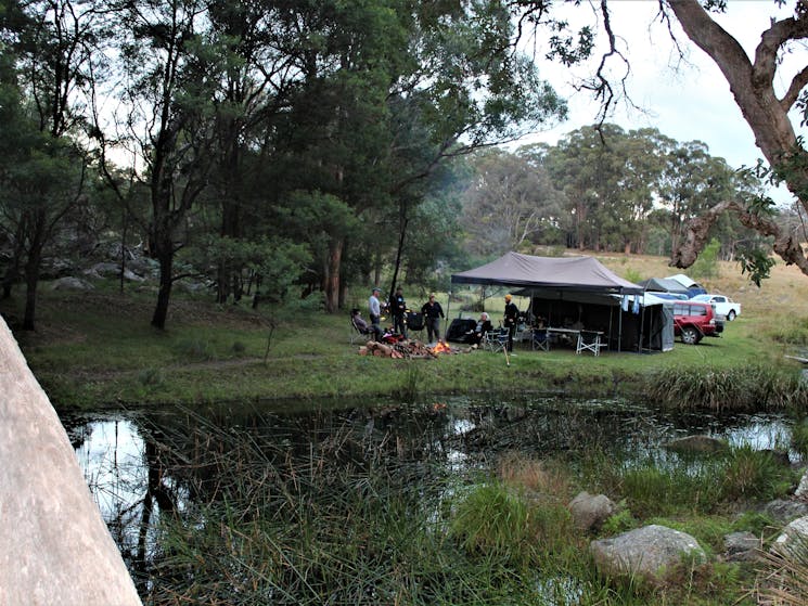 A campertrailer beside the water at one of our sites.