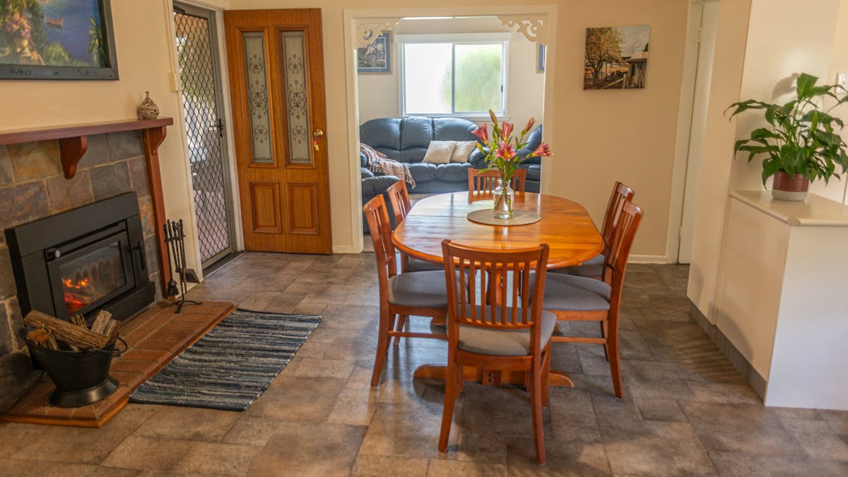 Marnita Farmhouse Dining Room with Fireplace