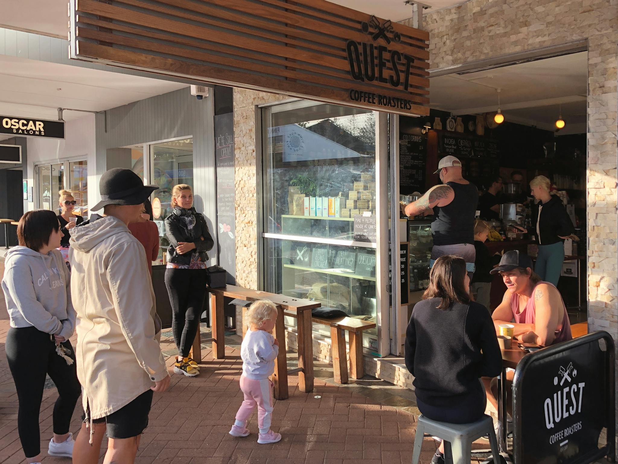 People awaiting drink and food orders at Quest Burleigh Cafe People awaiting drink and food orders at Quest Burleigh Cafe
