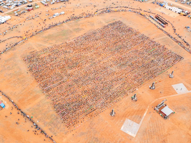Overhead view of thousands of the mass square dance at the Mundi Mundi Bash