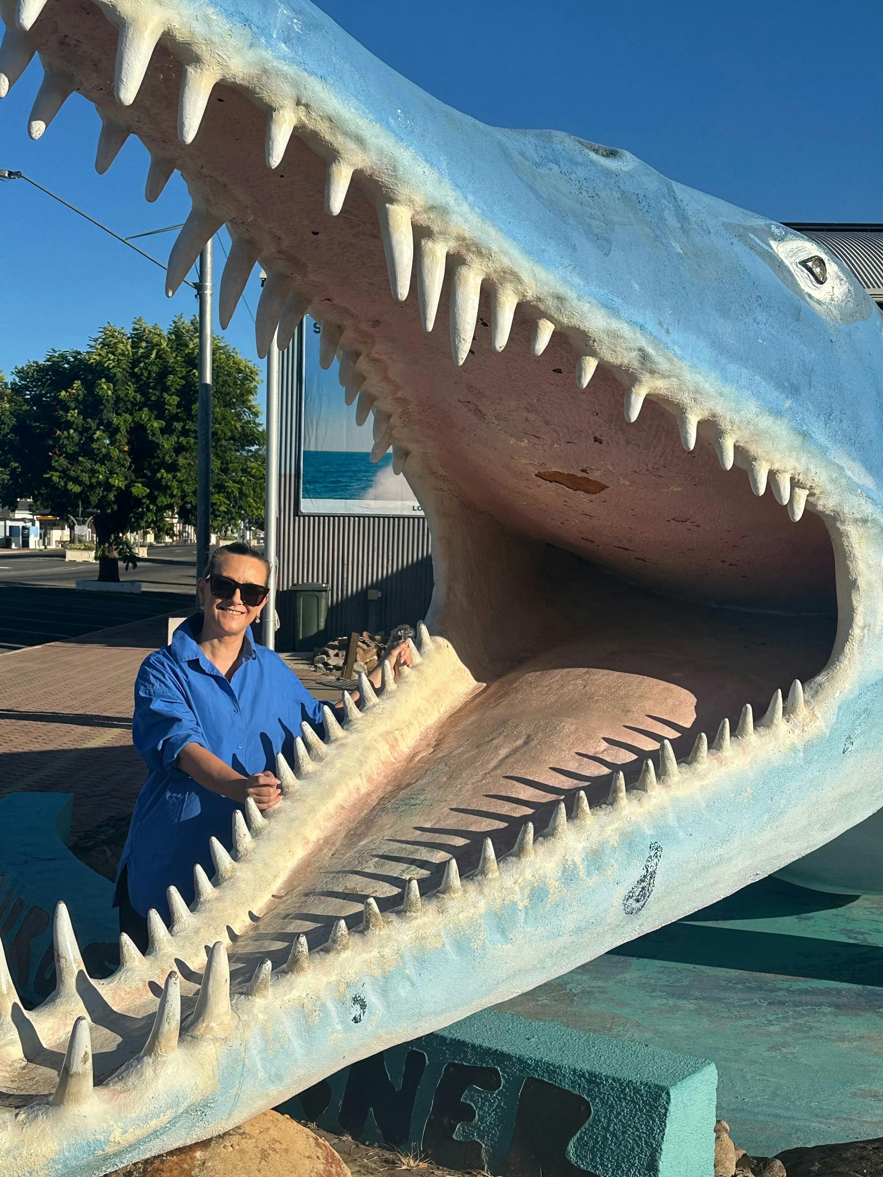 A person standing next to Kronosaurus