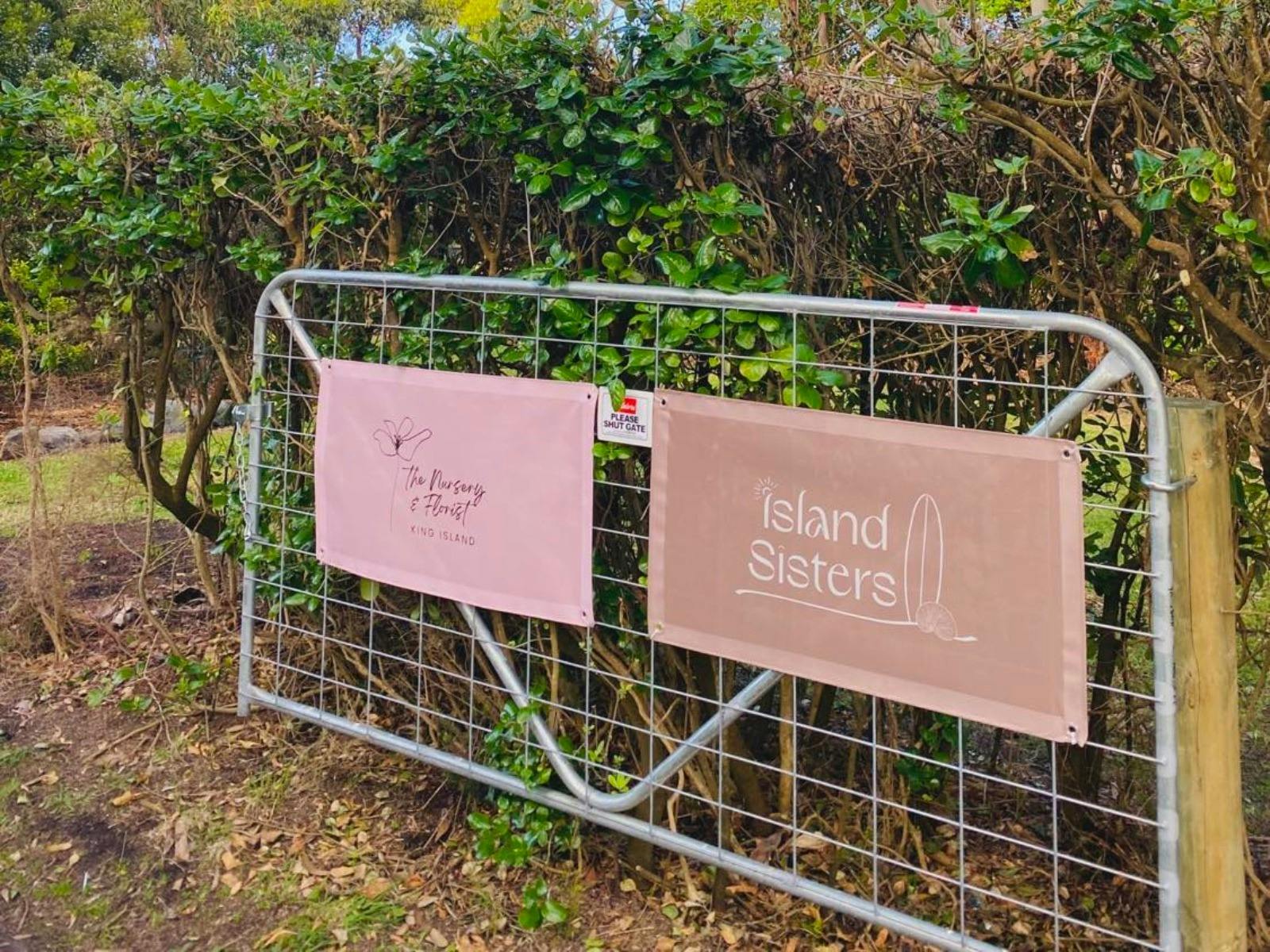 The Nursery & Florist and Island Sisters signs