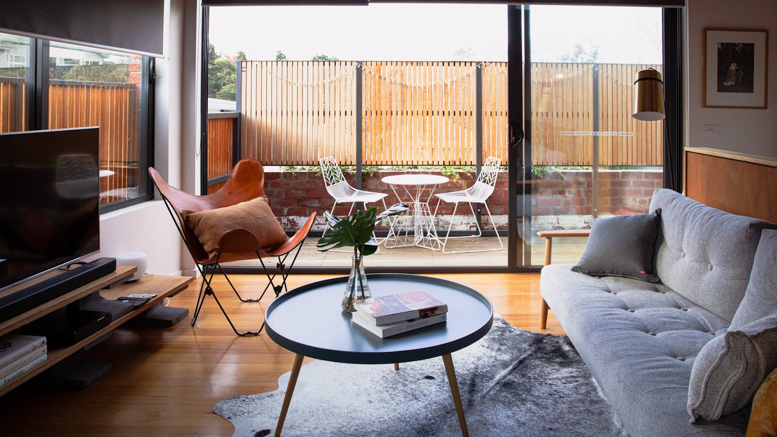 The sun filled living area with stacking doors to let the outside in or enjoy your evening drinks.