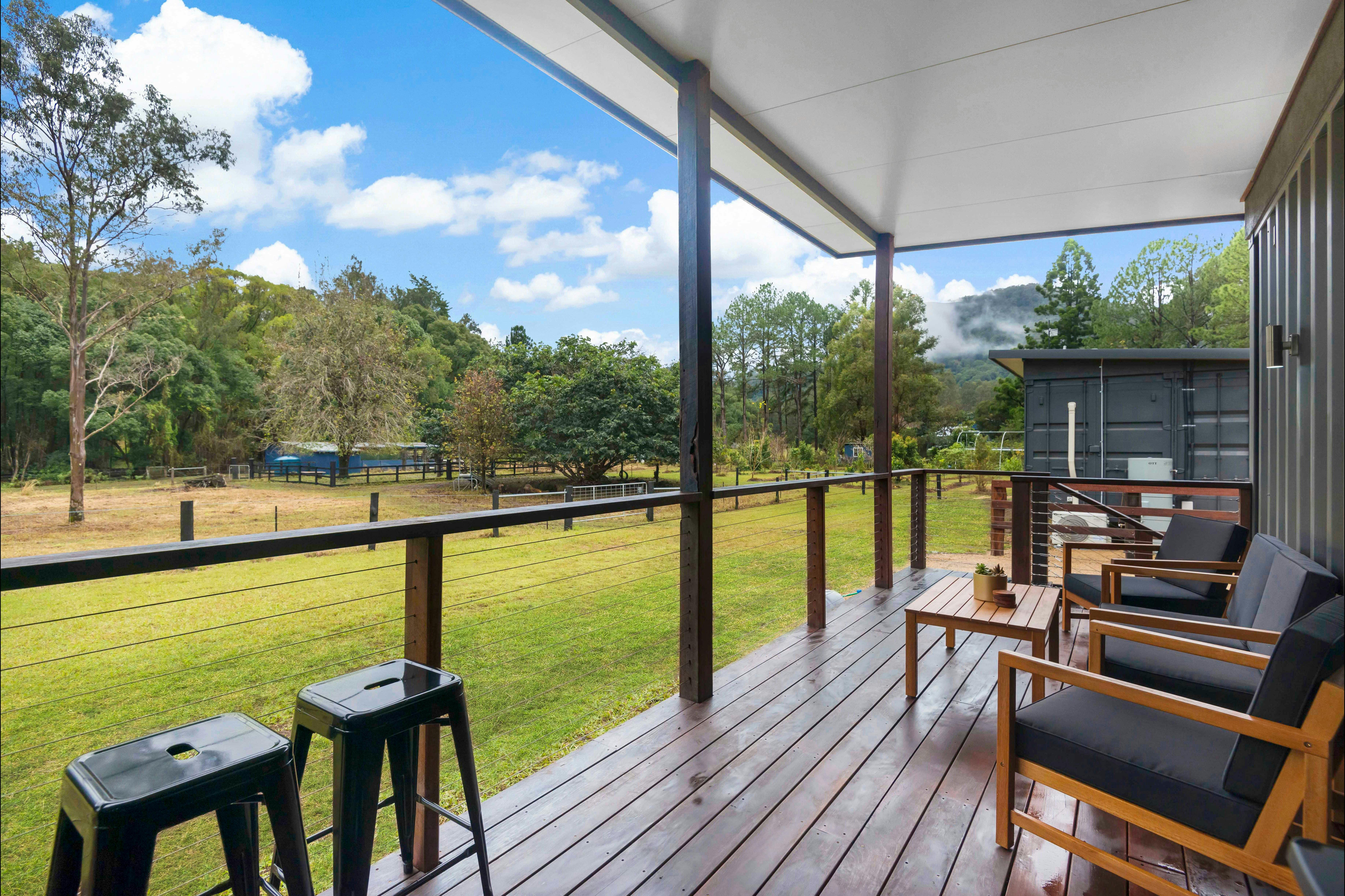 The hardwood deck on each cottage is a beautful spot to relax and take in the views