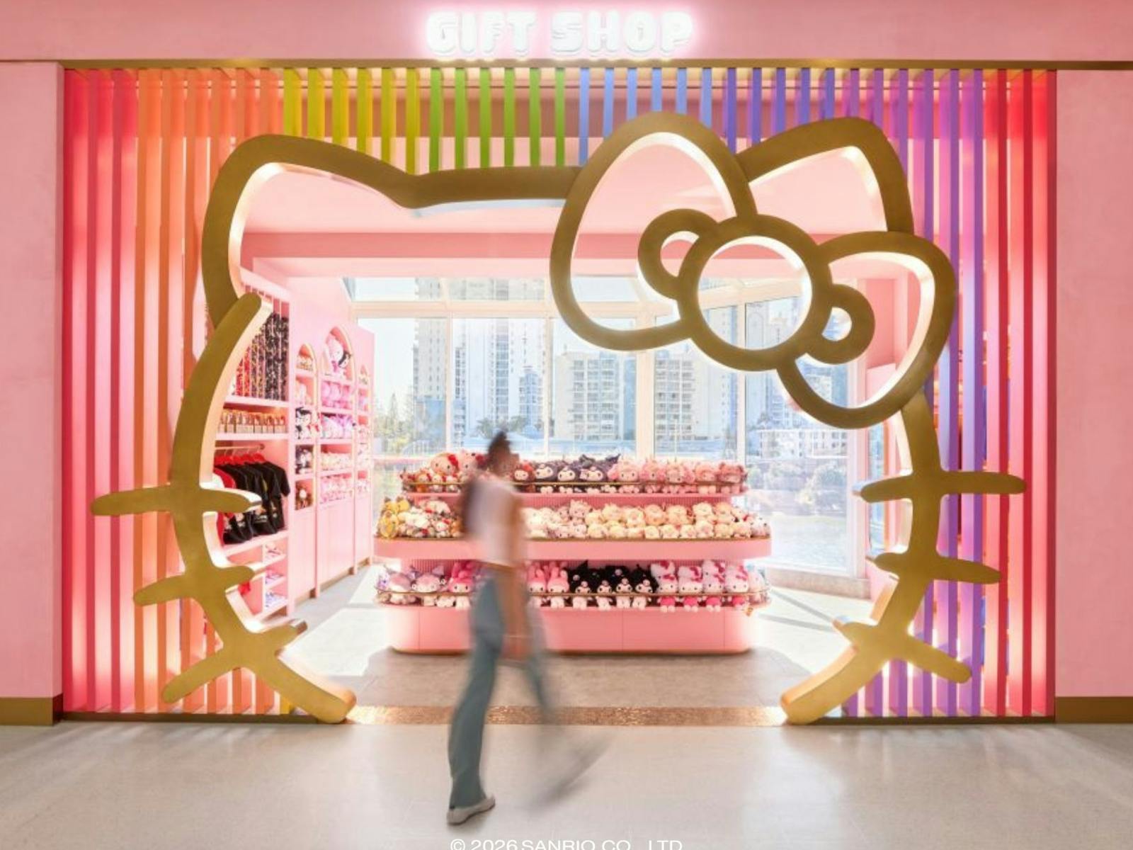 A retail entrance framed by a large Hello Kitty silhouette with pink interior. A retail entrance framed by a large Hello Kitty silhouette with pink interior.