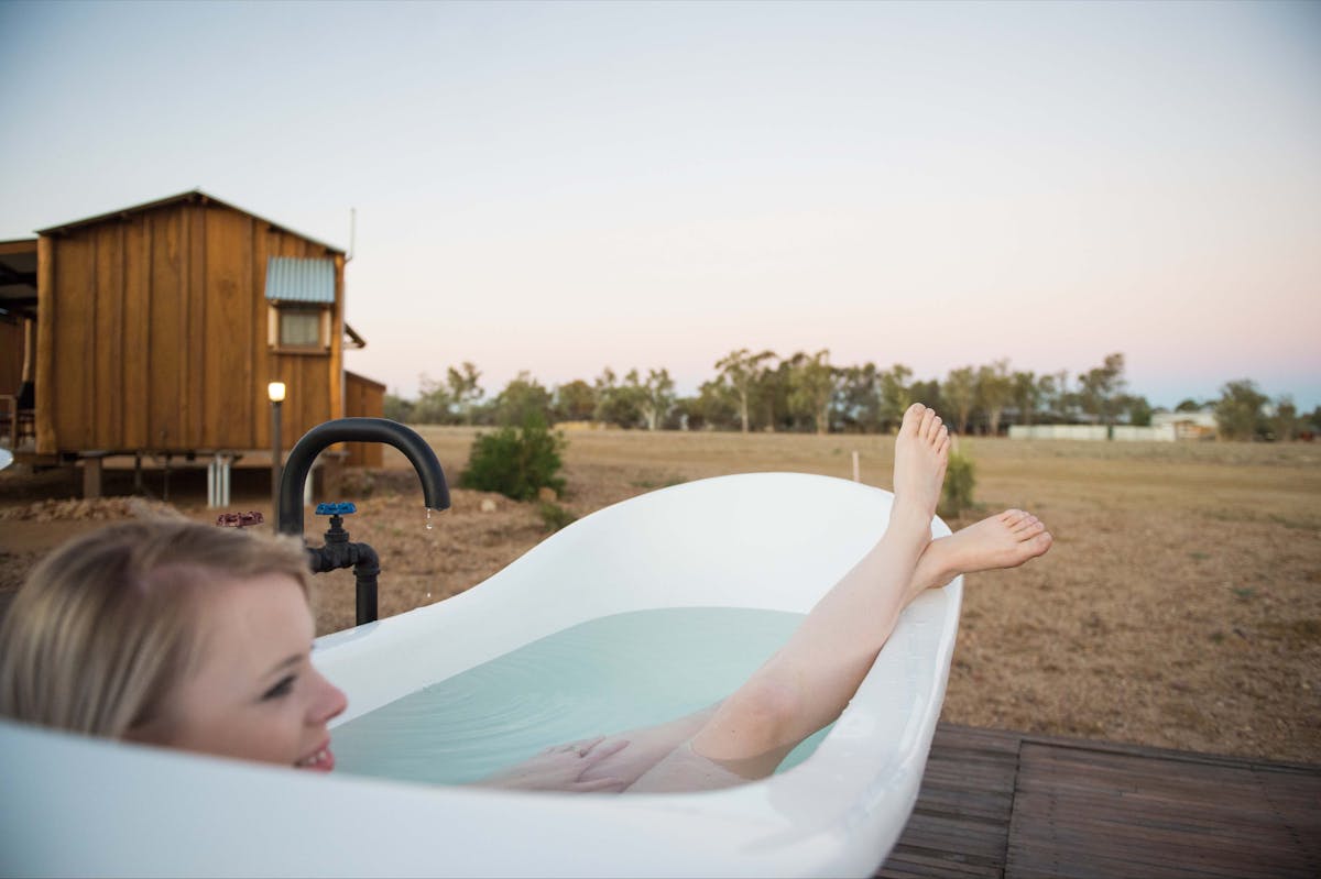 Relaxing in the outdoor baths by the Pioneer Slab Huts