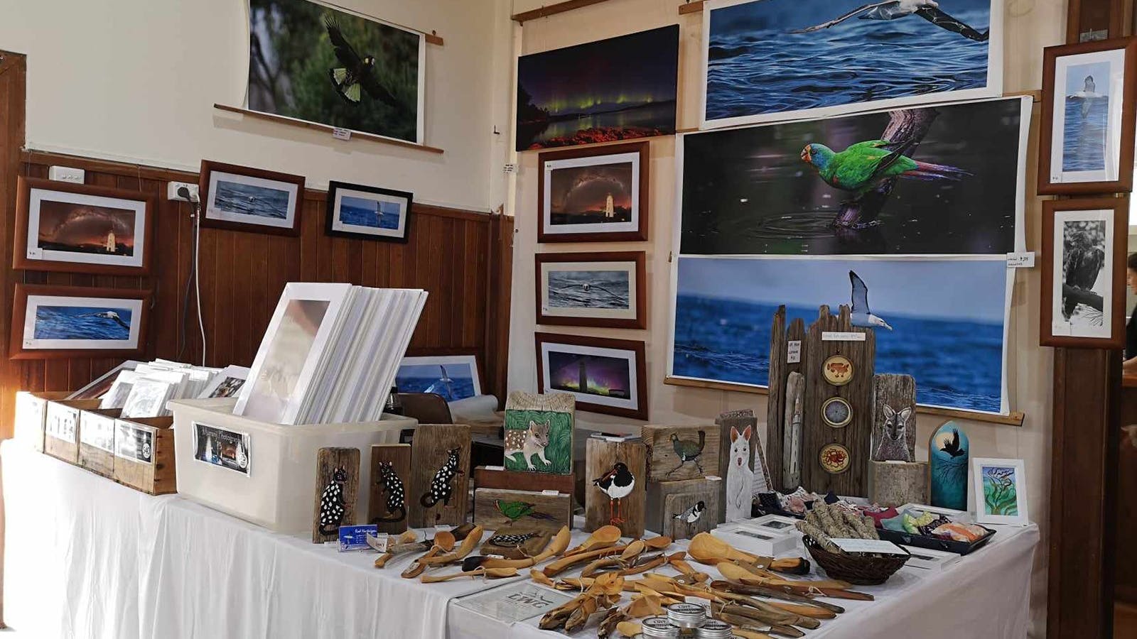 A display of Rod Hartvigsen's Photography, Landfall Woodcraft and original artworks by Kerry Marvel
