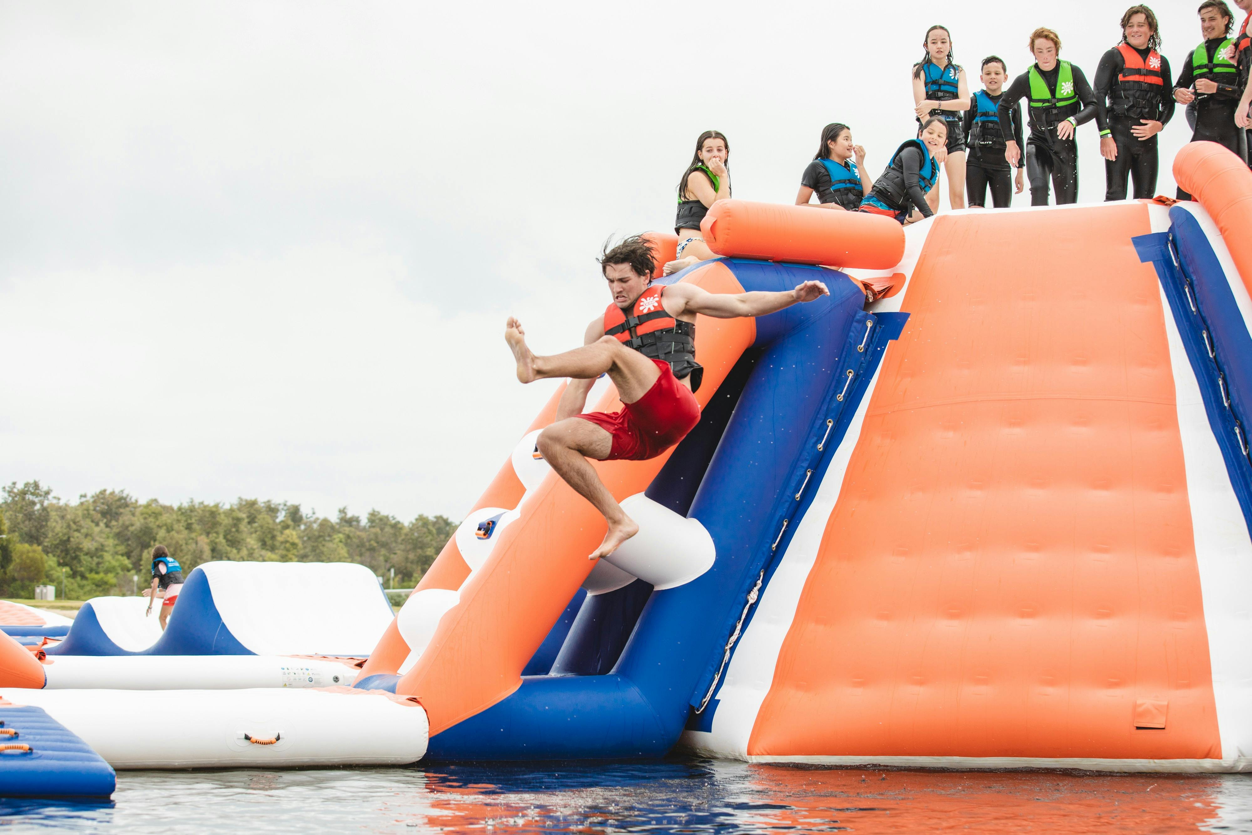 Person jumping from Slippery slides