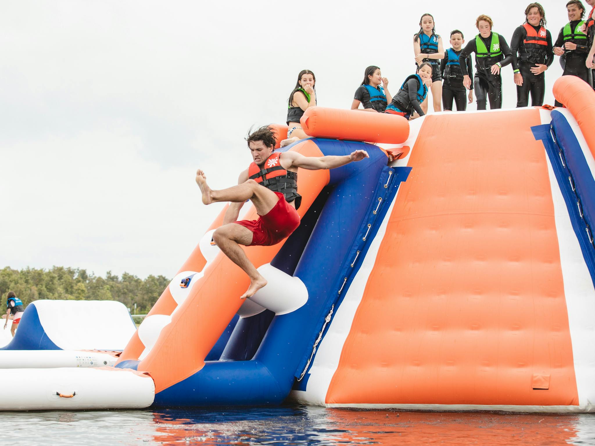 Person jumping from Slippery slides