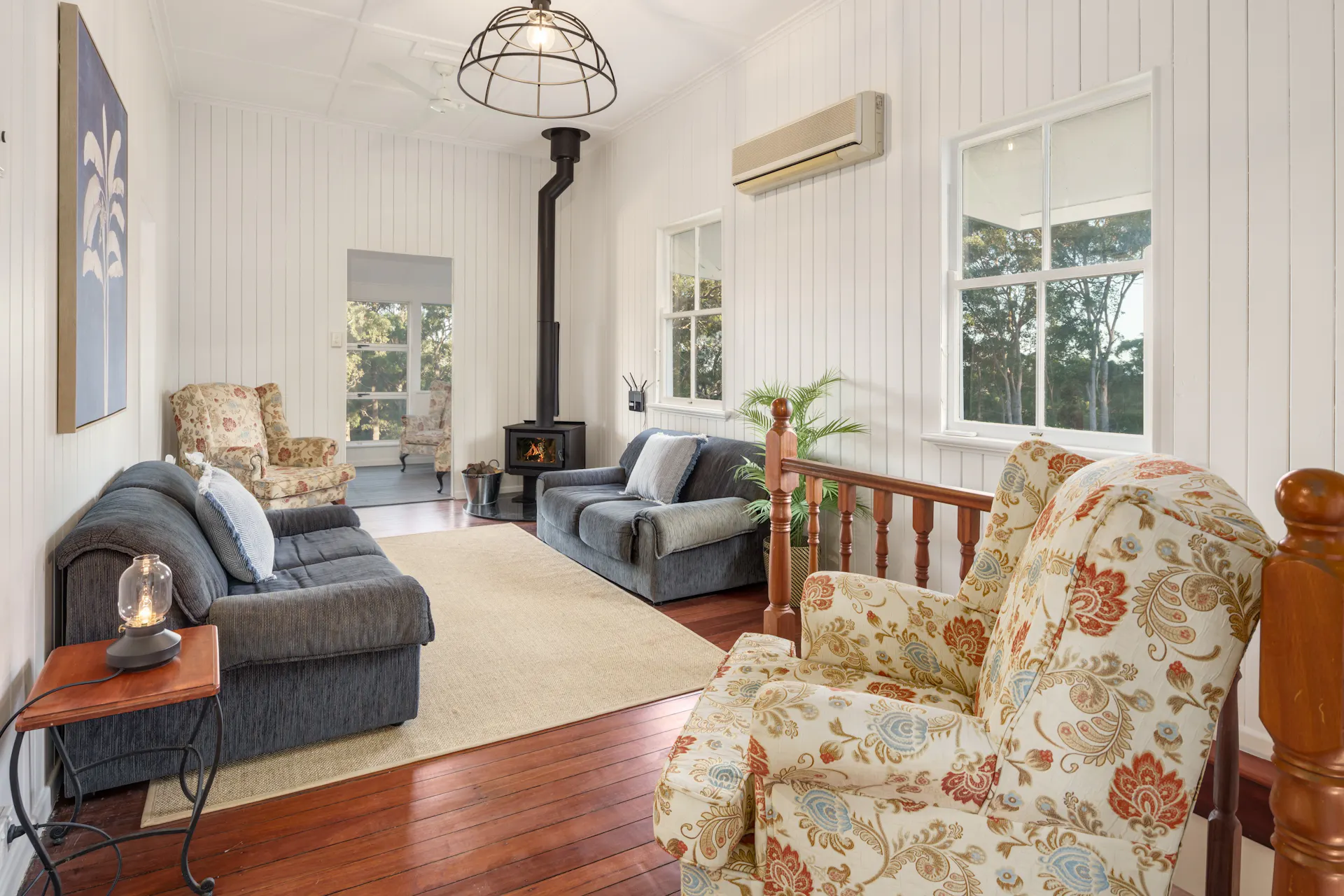 The cosy upstairs living room with a fireplace.