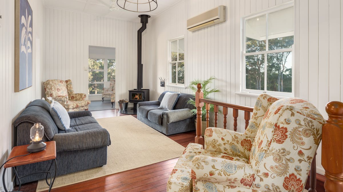 The cosy upstairs living room with a fireplace.