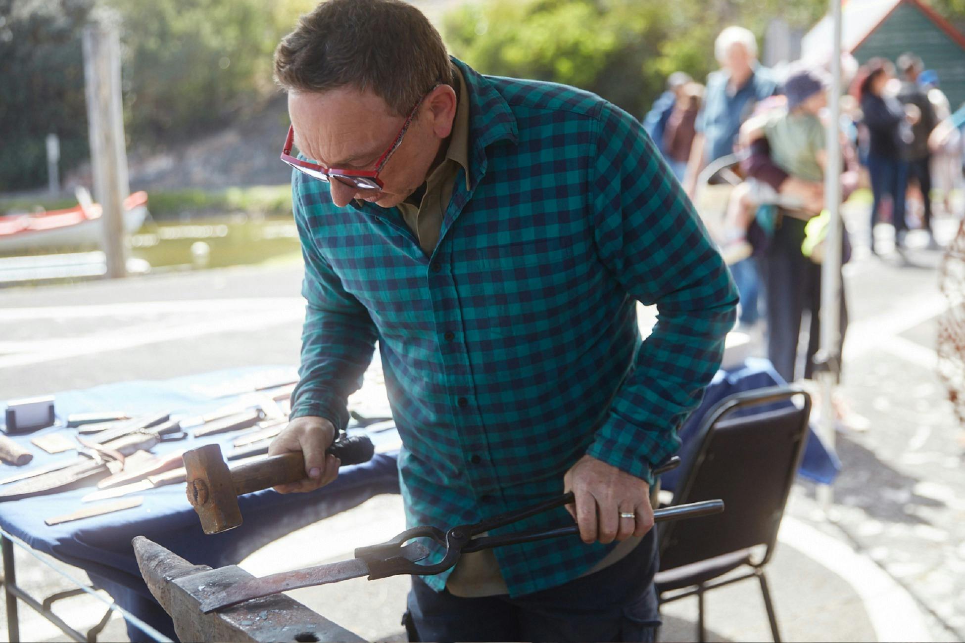 craftsman working on a knife