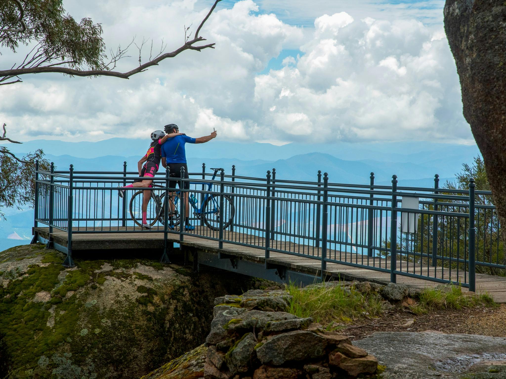 Road cyclists at The Gorge lookout on top of Mount Buffalo
