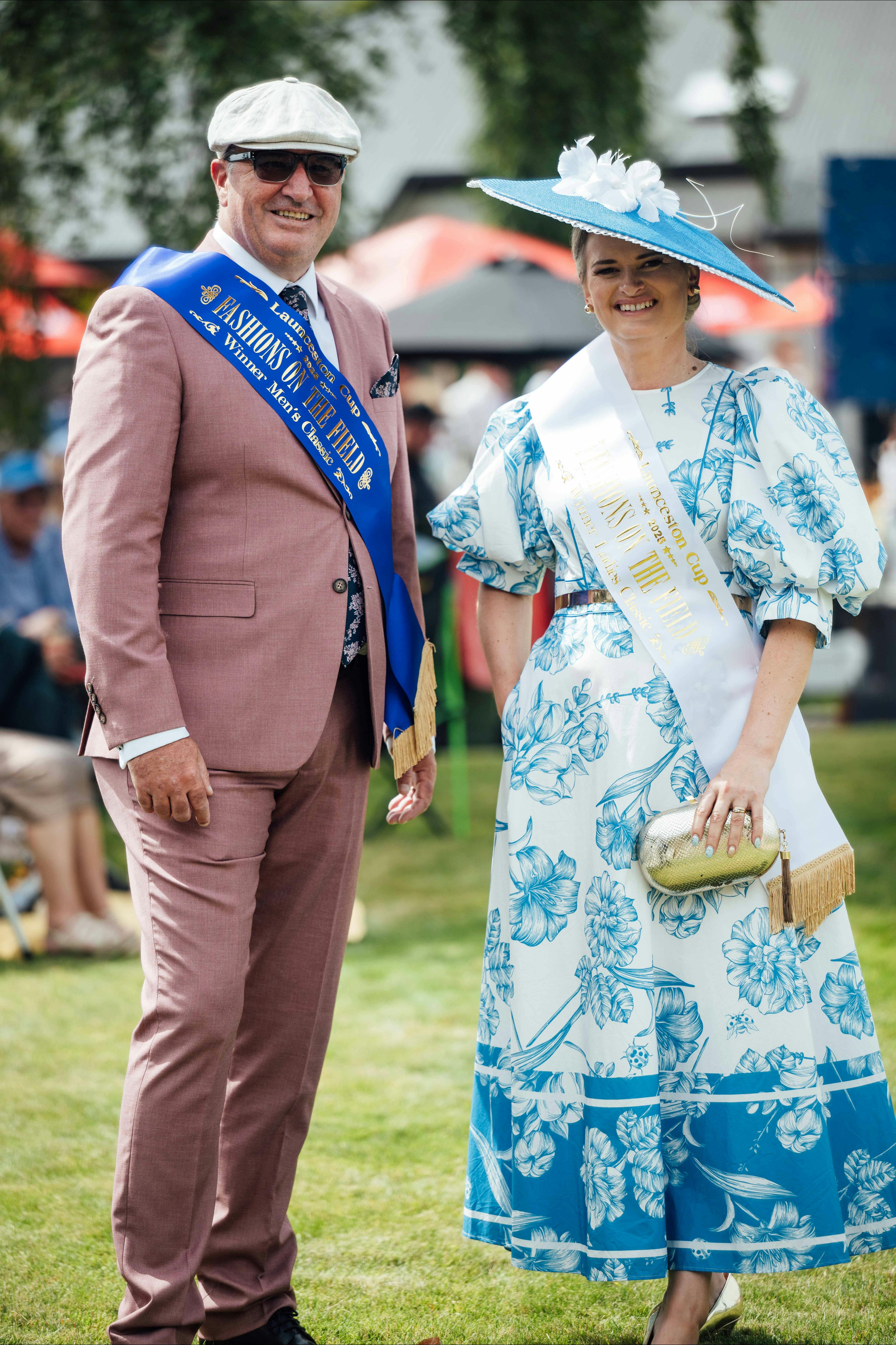 Man and woman posing with winning sash