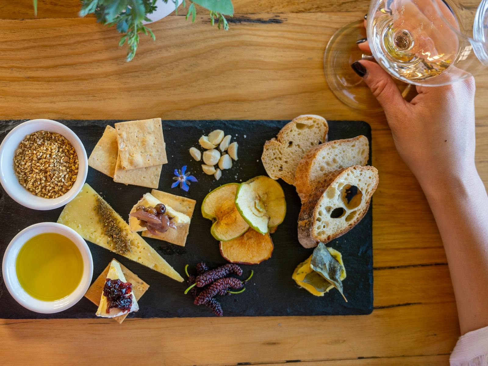 Native Food Plate with a glass of wine on table