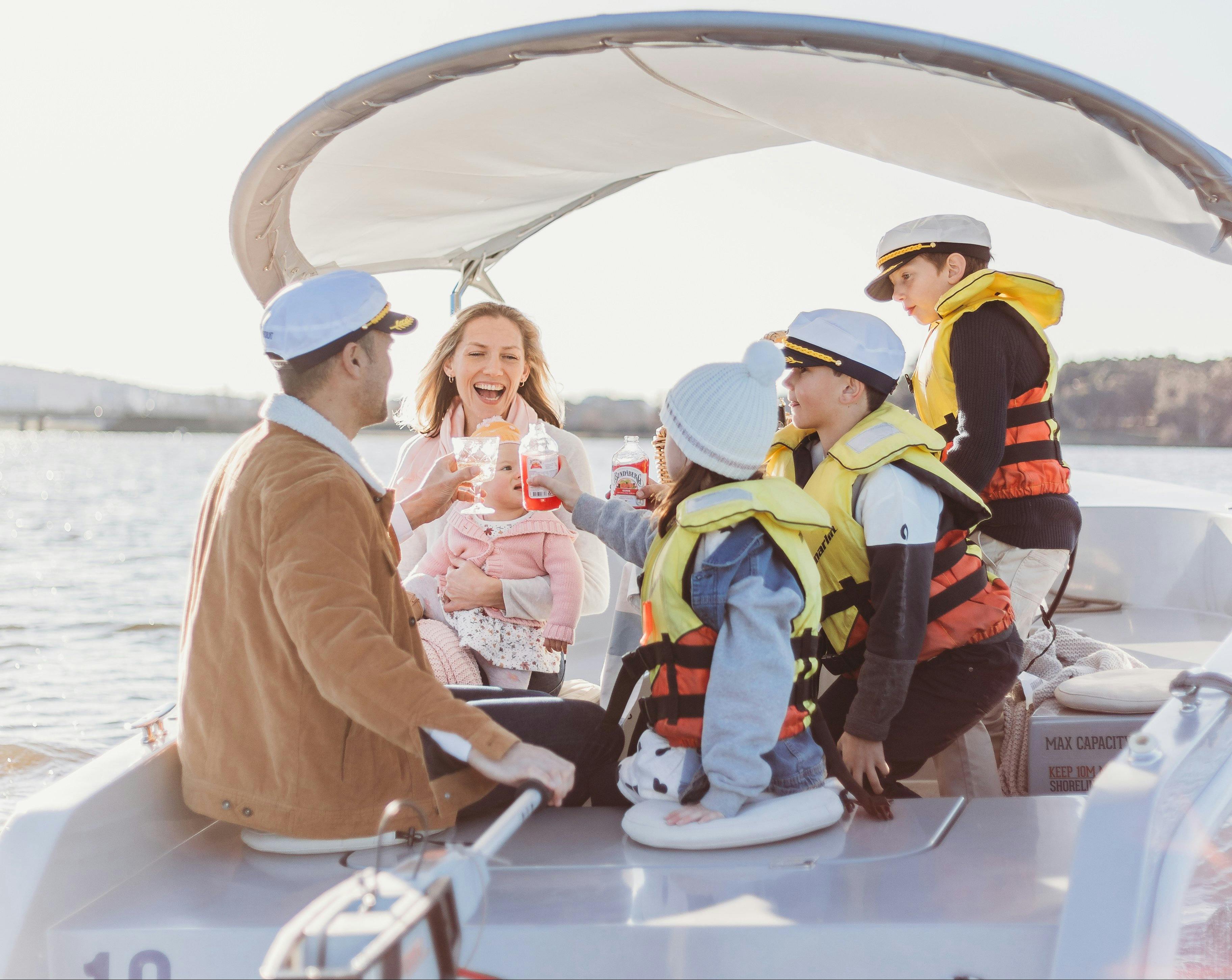 Group Enjoying a Picnic Aboard a Luxury Electric Boat on Lake Burley Griffin