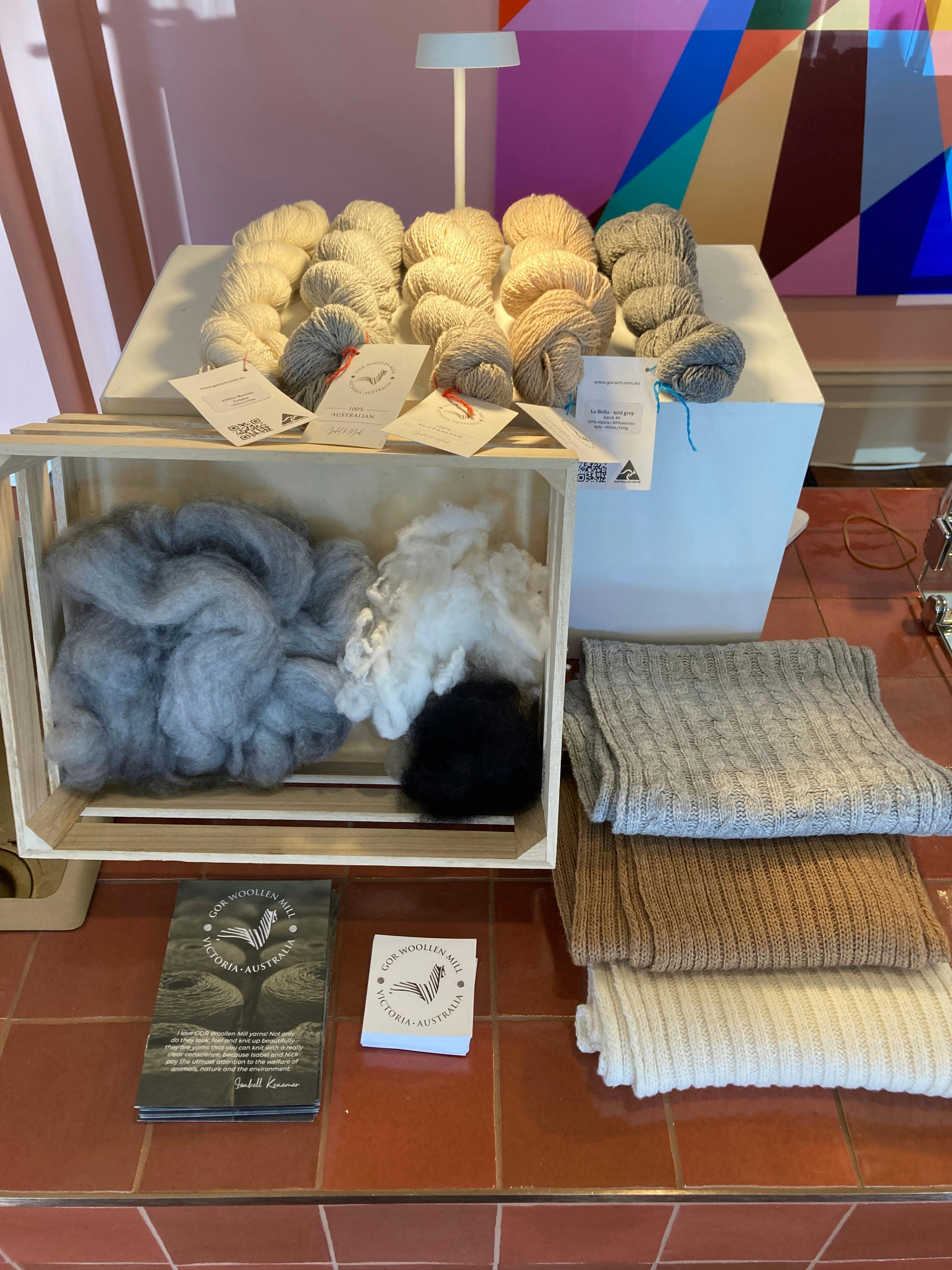 yarn and raw wool on  display within a shop environment