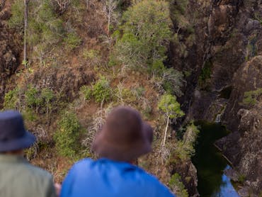 Aerial view of people looking down at kinbombi falls from the lookout Aerial view of people looking down at kinbombi falls from the lookout