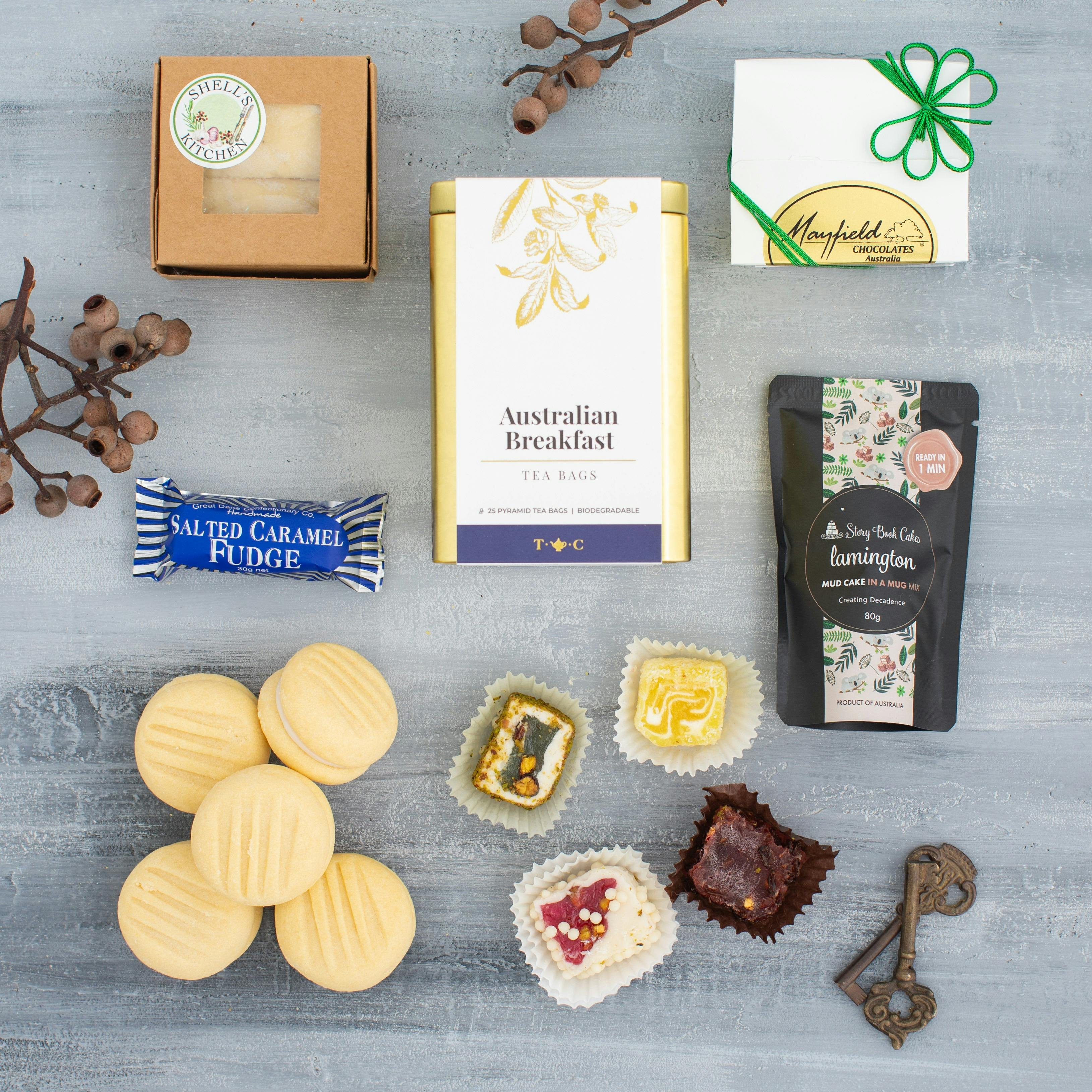 features premium tea,  chocolates, melting moments, shortbread, mixed sweets.
