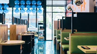 Well lit restaurant interior during the day