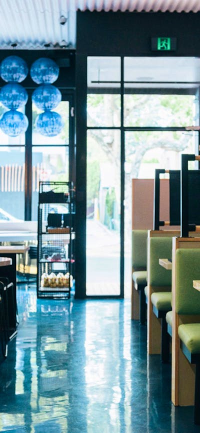 Well lit restaurant interior during the day