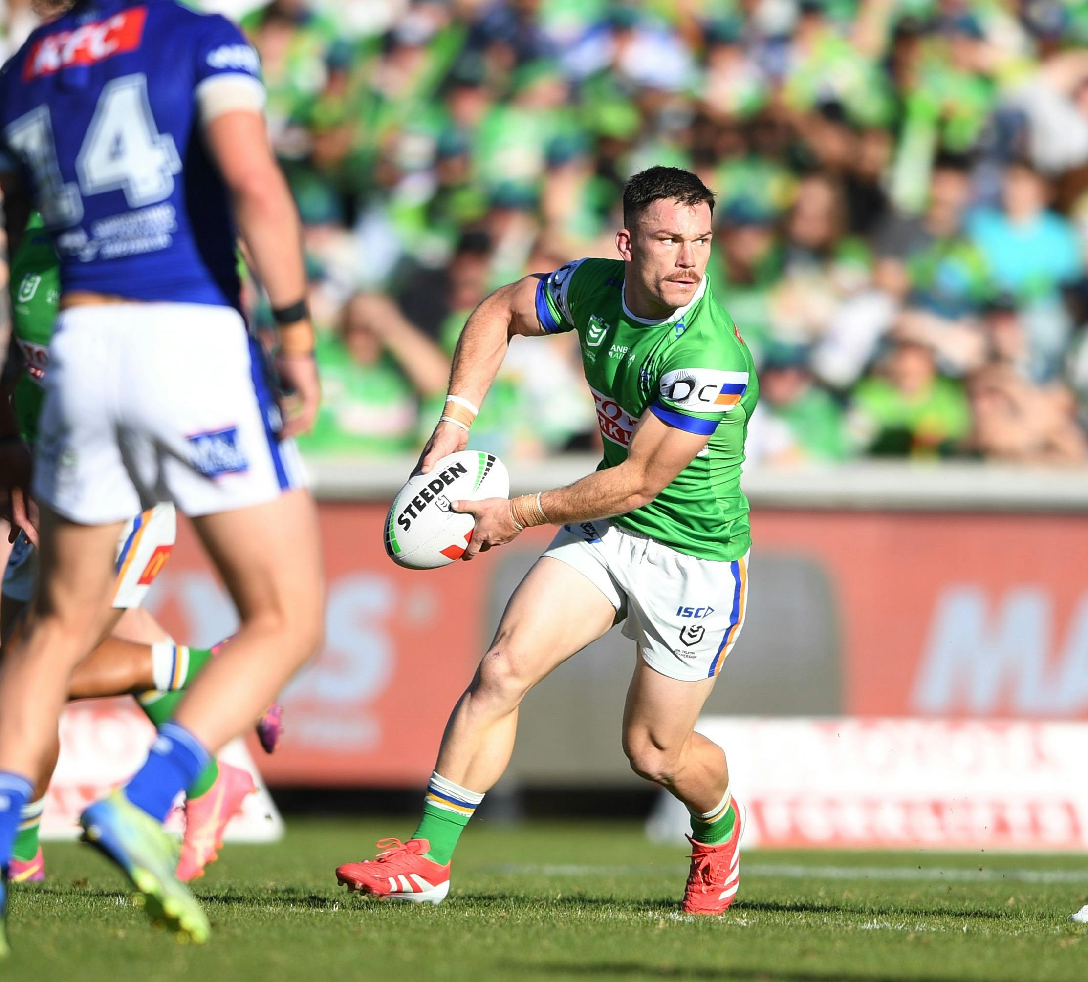 Canberra Raiders player Tom Starling passing the ball.