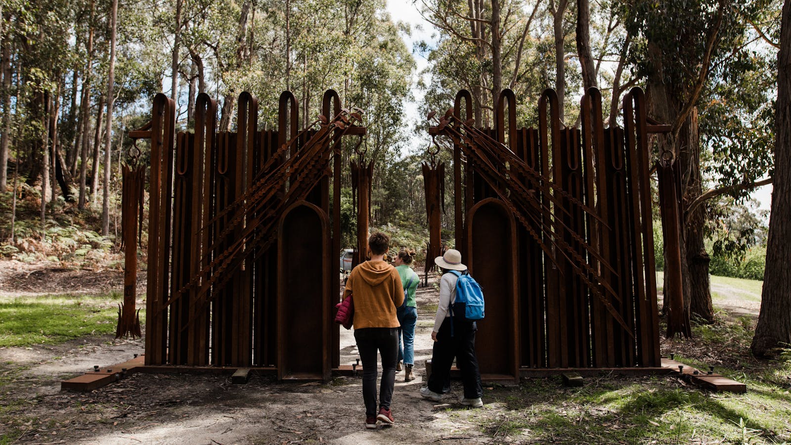 Visitors walking through Offerings by Pete Matilla