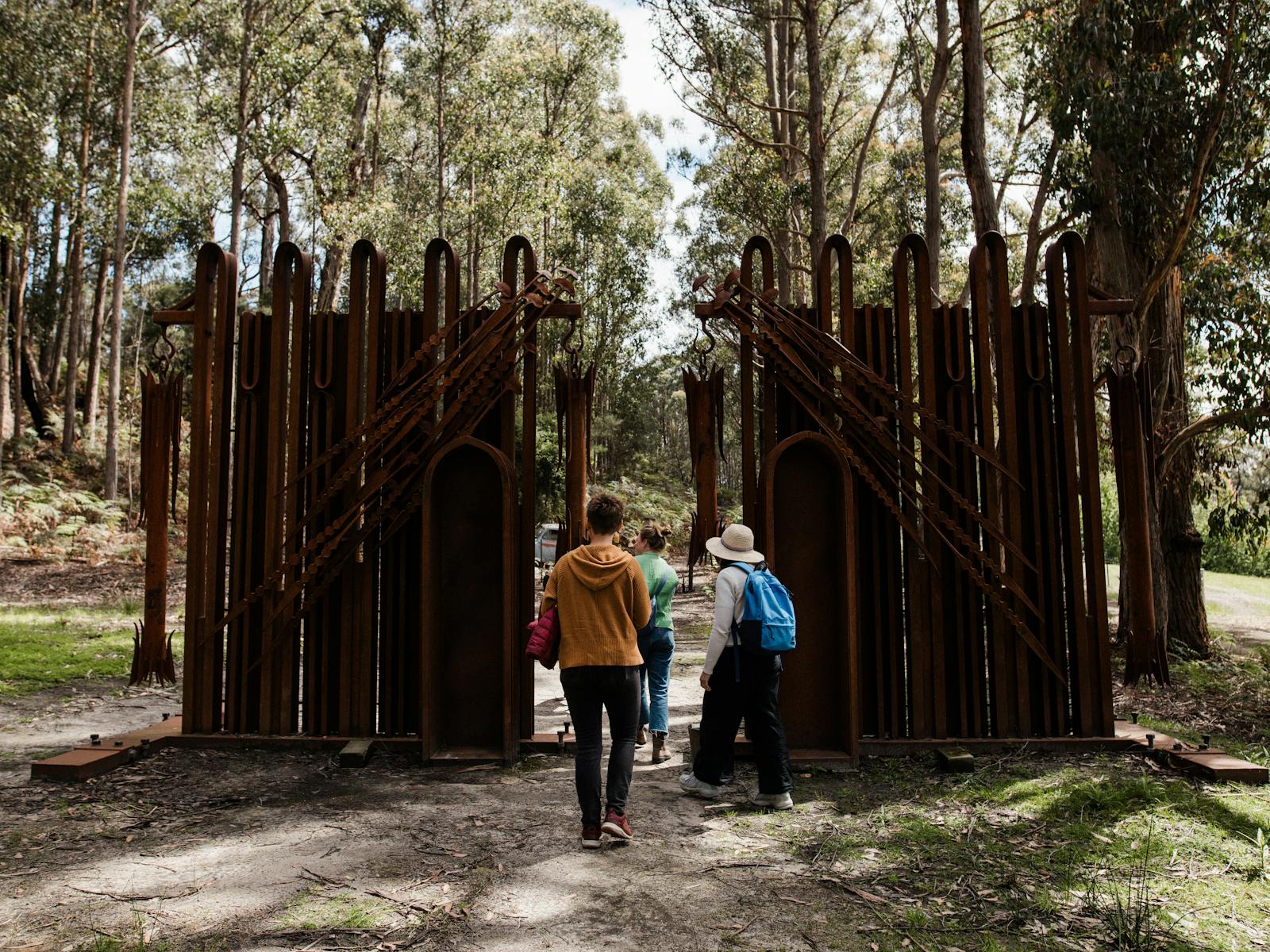 Visitors walking through Offerings by Pete Matilla
